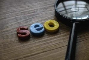 SEO spyglass and letter blocks